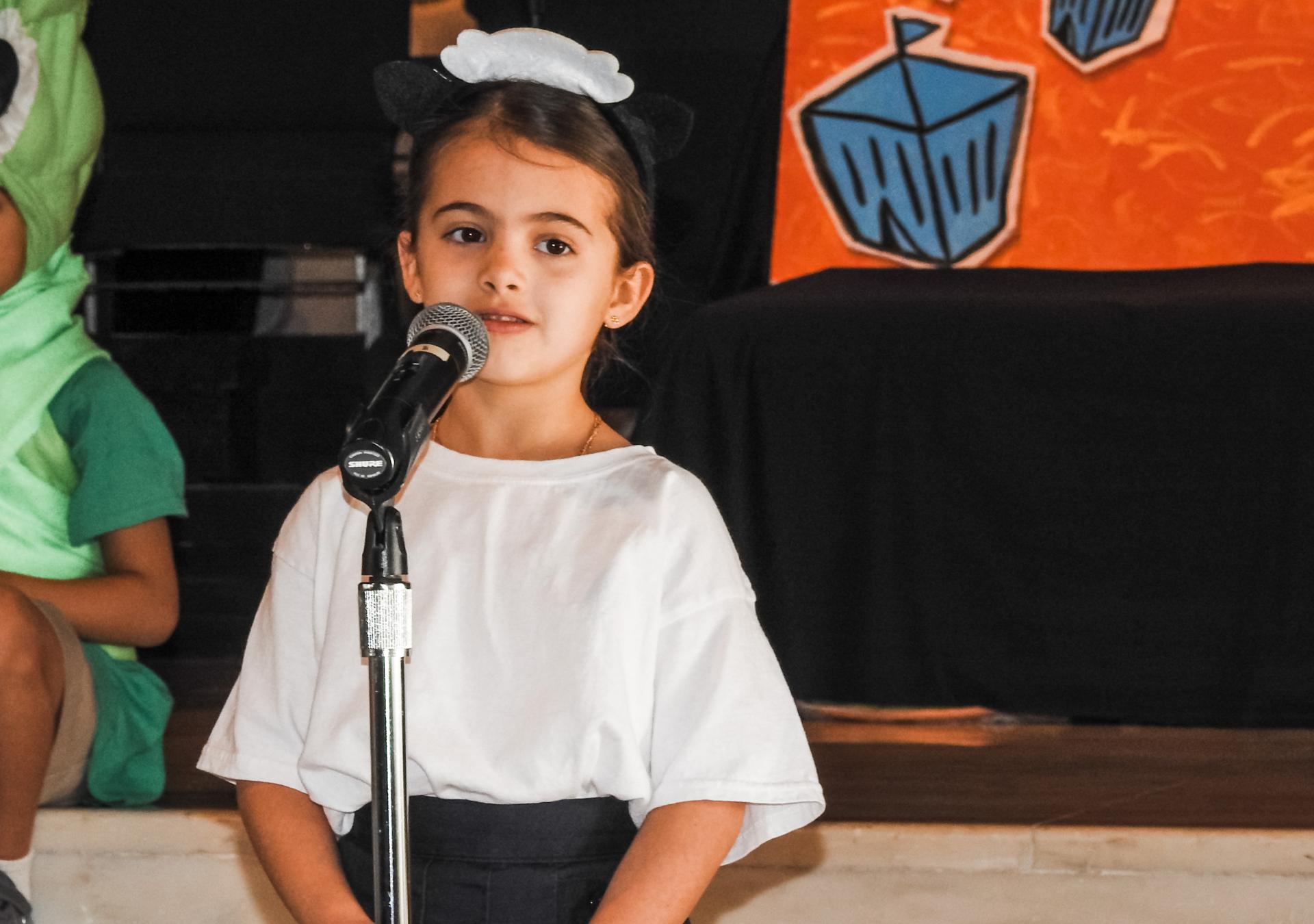 CCS STORIES  Harness Words  Standing in front of families gathered to celebrate the end of the team’s season, the girl from Christ Church School begins to speak. Her soft voice grows stronger with each sentence. She is funny and sincere, but it’s not her words people notice - it’s her composure. Like all her classmates, she has presented to ever-larger groups since pre-kindergarten. She is not intimidated. The girl will surely have big ideas one day. Whether it’s to an audience of one or one thousand, she will know how to harness words to describe them. Communication is her superpower.